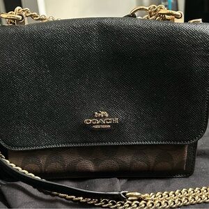 Coach Black and Brown Crossbody Bag with gold chain.